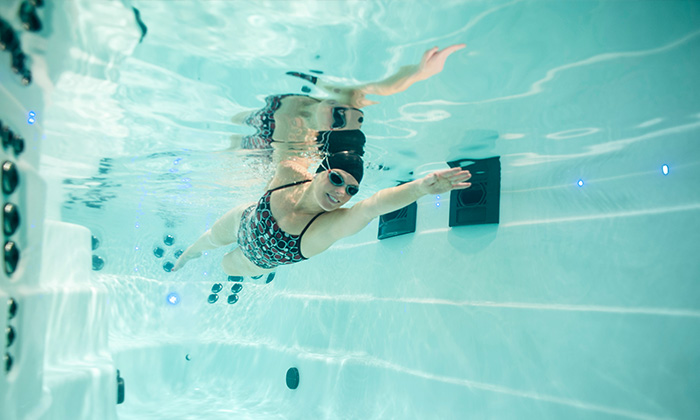 woman training in a michael phelps swim spa
